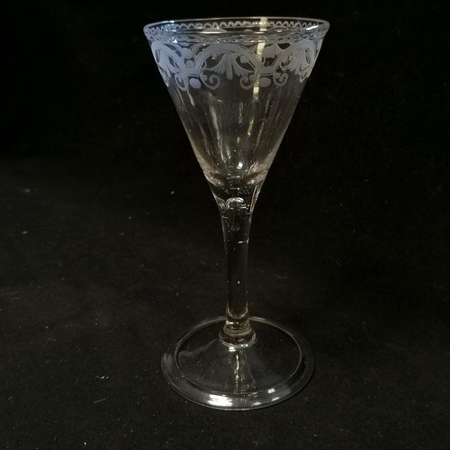 11 - Mid 18th century wine glass with folded footrim and unusual classical etched border to top and sport... 