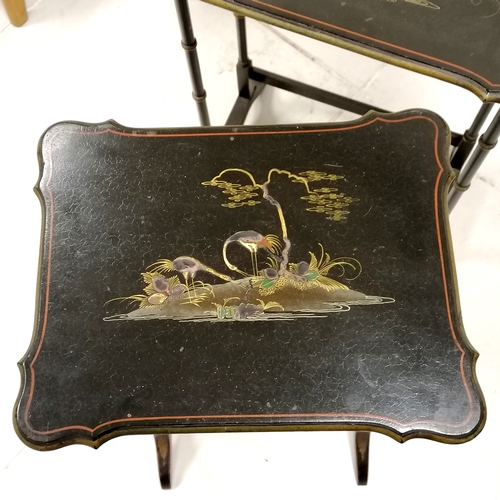 60 - Nest of Oriental lacquer tables with gilded scenes to the tops 54cm x 36cm x 63cm high. Some slight ... 