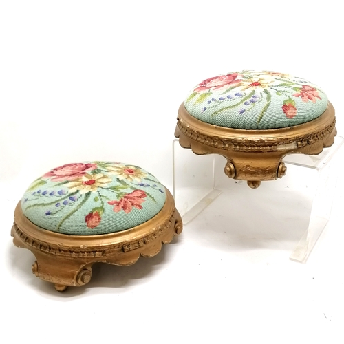 63 - Pair of antique giltwood circular stools upholstered with floral tapestry 36cm diameter.