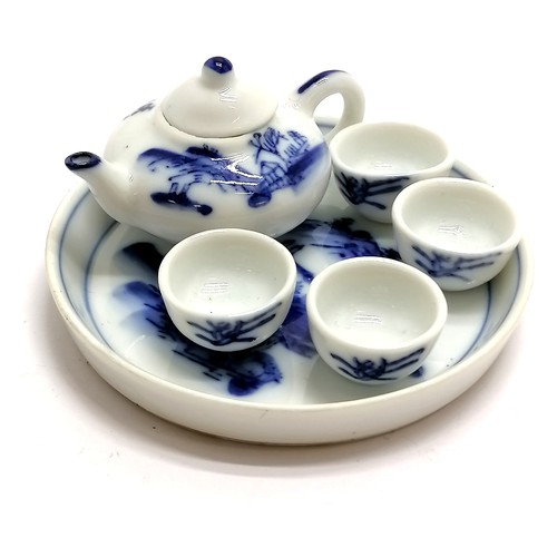 219 - Oriental miniature blue & white tea set on tray (7.8cm diameter) - no obvious damage