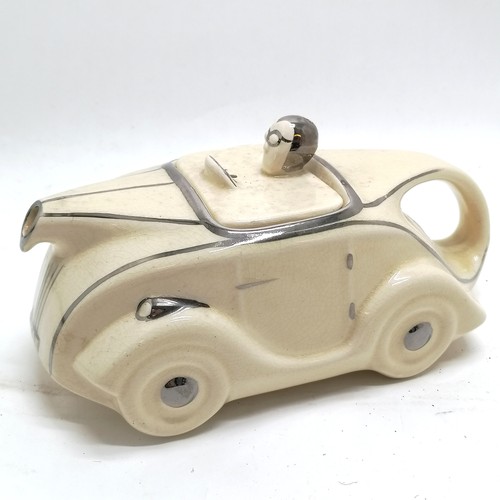 224 - Art Deco cream china car teapot with silver painted detail, bearing registration mark to base 23cm l... 