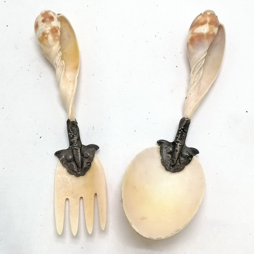 225 - Pair of antique unmarked silver mounted shell salad servers 22cm long. Some wear to the mounts other... 