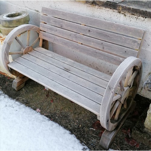 443 - Wooden garden bench with cartwheel design to ends - 112cm x 56cm deep x 73cm high