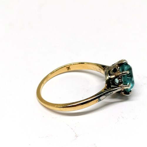 568 - 18ct marked gold blue topaz solitaire stone set ring - size N½ & 2.9g total weight ~ stone has wear