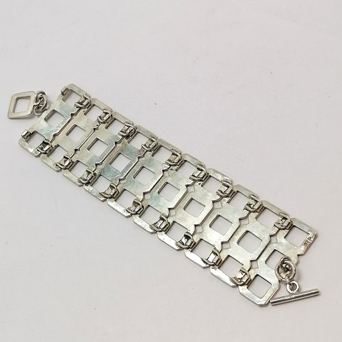 585 - Unusual 925 silver marked triple row bracelet - 18cm long & 3.6cm wide & 64g - SOLD ON BEHALF OF THE... 