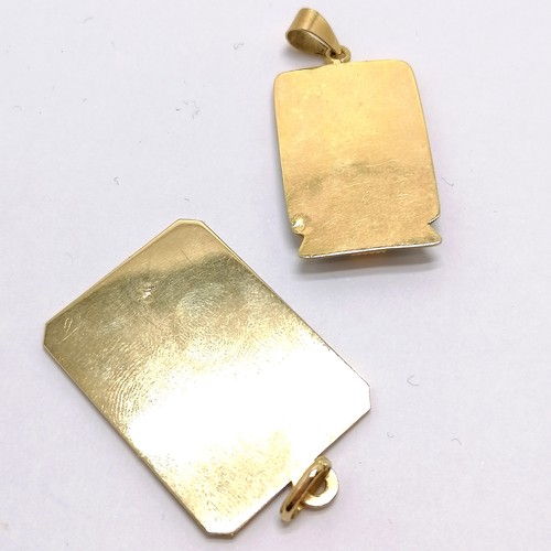 604 - 2 x Egyptain foreign marked (both touch test as 18ct) panel pendants (1 set with blue enamel detail)... 