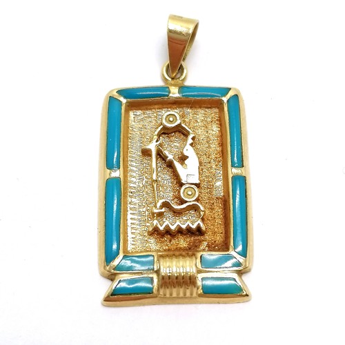 604 - 2 x Egyptain foreign marked (both touch test as 18ct) panel pendants (1 set with blue enamel detail)... 