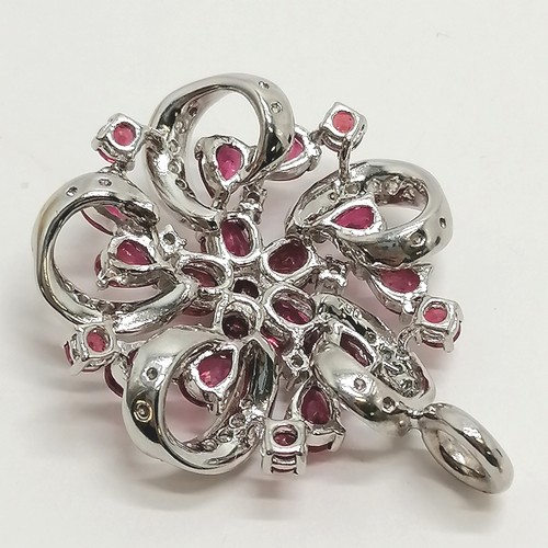 640 - 18ct marked white gold ruby & diamond set pendant - 3.5cm drop & 10.5g total weight