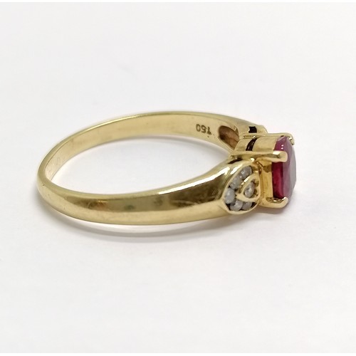 661 - 18ct marked gold ruby ring with heart shaped shoulders channel set with diamonds (14) - size N & 3.1... 