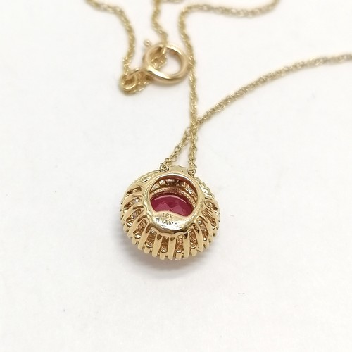 673 - Iliana 18ct gold ruby (5.8mm) circled by baguette diamonds pendant on 18ct marked gold 44cm chain - ... 