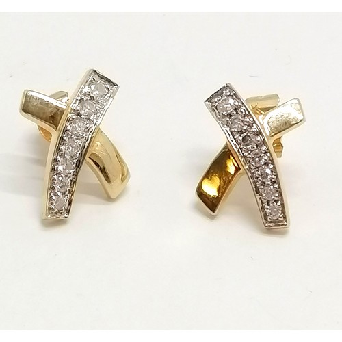 674 - Pair of 9ct marked gold earrings set with diamonds (total 0.25ct) - 1.5cm across & 2g total weight