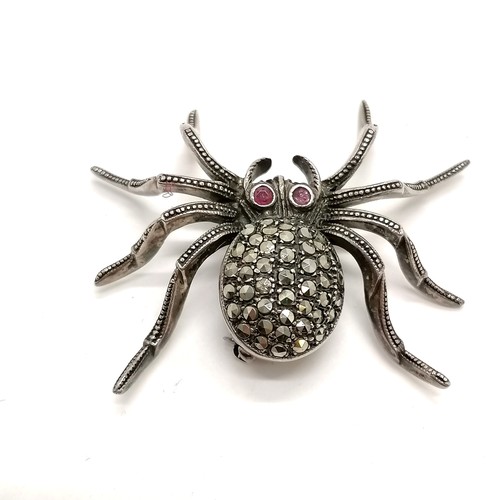 684 - Silver spider brooch set with marcasite & ruby eyes (4cm) t/w silver marcasite flowers brooch - 17g ... 