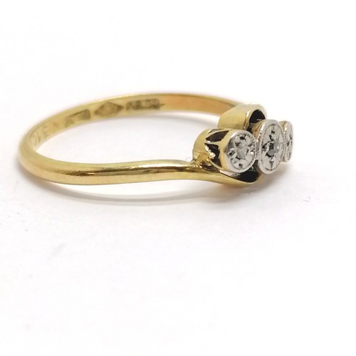 694 - Antique 18ct gold & platinum 3 stone diamond illusion set crossover ring - size L & 2g total weight