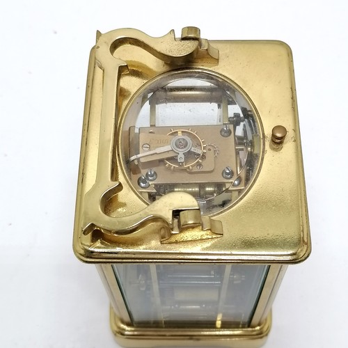 789 - Antique brass carriage clock with bell strike mechanism and key - total height (inc handle) 18cm