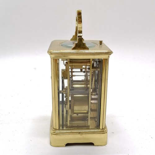 789 - Antique brass carriage clock with bell strike mechanism and key - total height (inc handle) 18cm