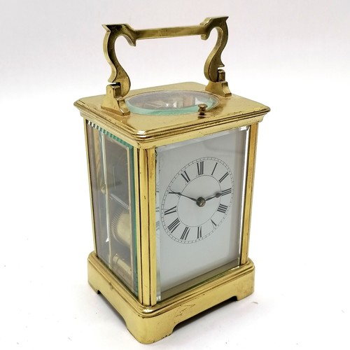 789 - Antique brass carriage clock with bell strike mechanism and key - total height (inc handle) 18cm