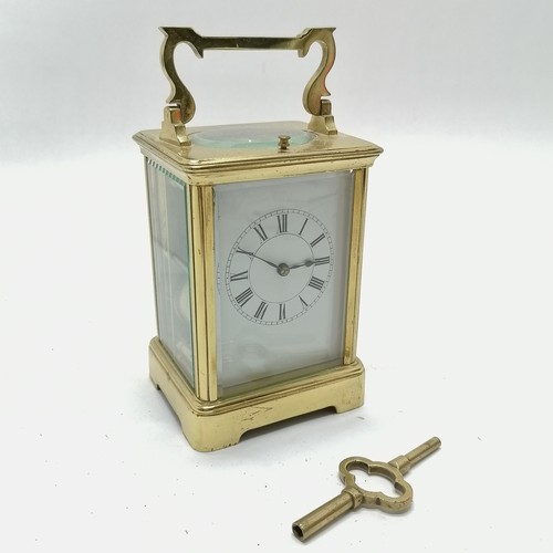 789 - Antique brass carriage clock with bell strike mechanism and key - total height (inc handle) 18cm