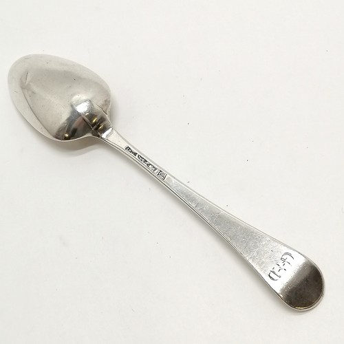 827 - Antique 1775 silver hallmarked tablespoon with initials G + D - 21cm & 78g. Has slight dents to bowl