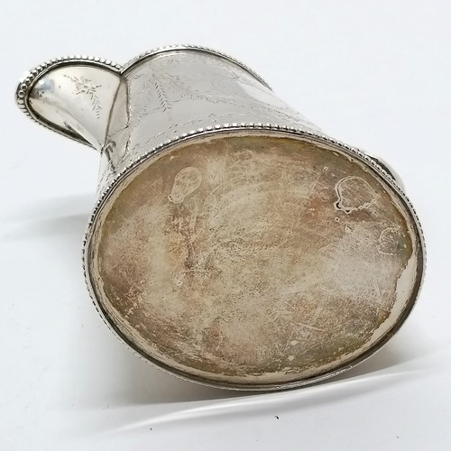 836 - Victorian silver cream / milk jug - 11cm high & 201g and has a lion crest. In good used condition