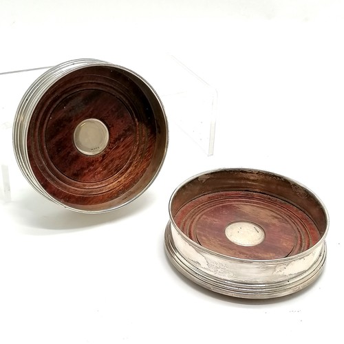 866 - Pair of sterling silver and turned wood bottle coasters - 12cm diameter and total weight 288g ~ slig... 