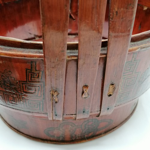 34 - Chinese rice carrier with metal hanging loop and paint decoration to lid and sides and has writing o... 