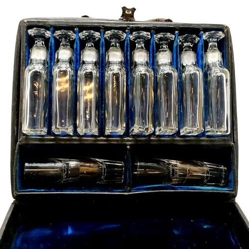 57 - Antique continental leather cased travelling / salesman decanter / drinks set with 8 decanters (brea... 