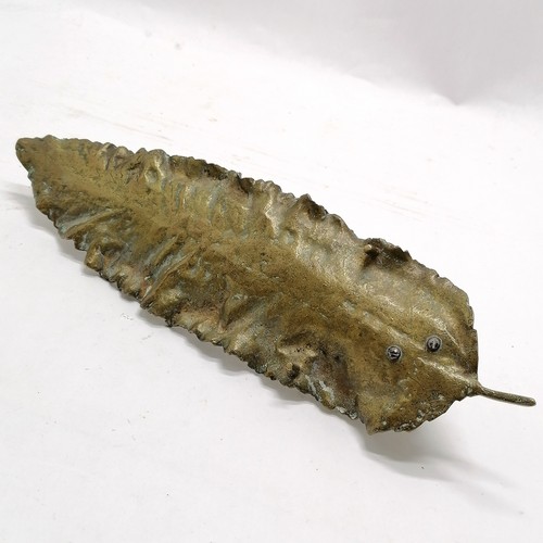 181 - Novelty antique brass pen tray in the form of a leaf with rabbit detail 32cm long