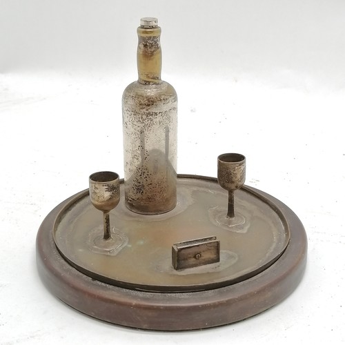 182 - Novelty desk stand as a drinks tray 12cm high x 14.5cm diameter - Bottle wobbles and losses to the p... 