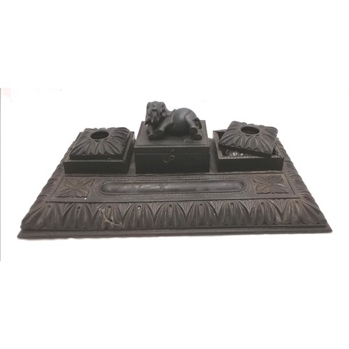 197 - Antique carved ebony desk stand with original inkwells and covers and an elephant on the central lid... 