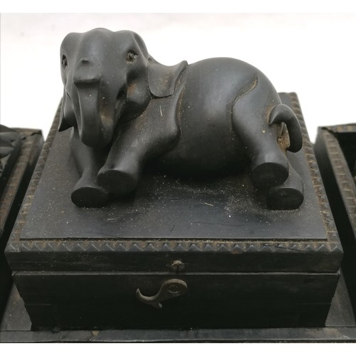 197 - Antique carved ebony desk stand with original inkwells and covers and an elephant on the central lid... 