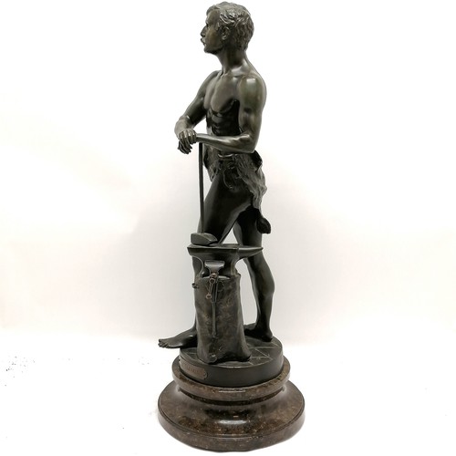 223 - Antique spelter study of a blacksmith titled 'Le Travail' (work) - 64cm high and is on a turned marb... 