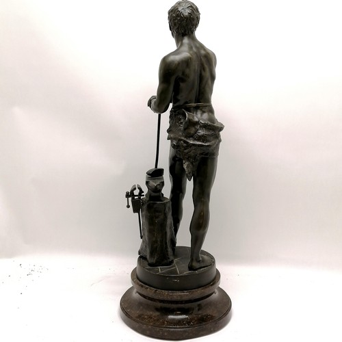 223 - Antique spelter study of a blacksmith titled 'Le Travail' (work) - 64cm high and is on a turned marb... 