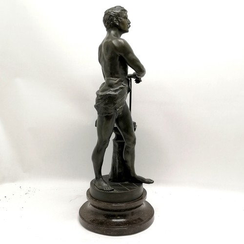 223 - Antique spelter study of a blacksmith titled 'Le Travail' (work) - 64cm high and is on a turned marb... 