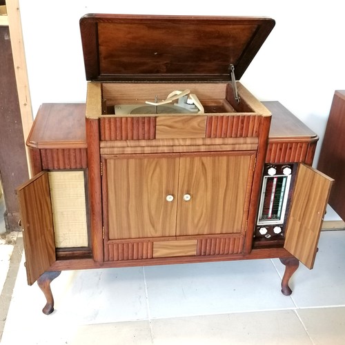 246 - 1950s mahogany radiogram with a Garrard autoslim 4 speed record player and a radio and storage for L... 