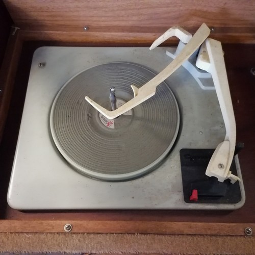 246 - 1950s mahogany radiogram with a Garrard autoslim 4 speed record player and a radio and storage for L... 