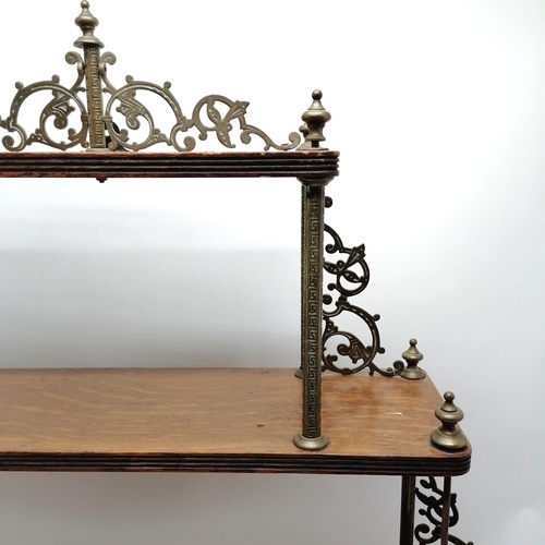 253 - Antique oak wall shelf with gilt brass mounts, some missing. 76cm wide x 15cm deep x 85cm high.