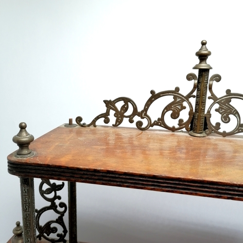 253 - Antique oak wall shelf with gilt brass mounts, some missing. 76cm wide x 15cm deep x 85cm high.