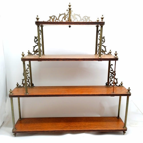 253 - Antique oak wall shelf with gilt brass mounts, some missing. 76cm wide x 15cm deep x 85cm high.