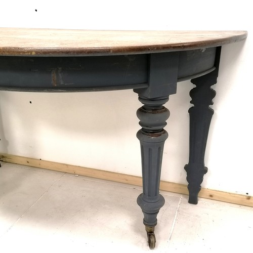 260 - Antique oak blue painted demi lune table with bras castors 31cm wide x 63cm deep x 73cm high. In goo... 