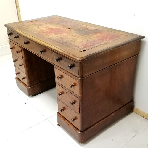 265 - Antique mahogany pedestal desk with china castors and red leather insert to top 107cm long x 67cm de... 