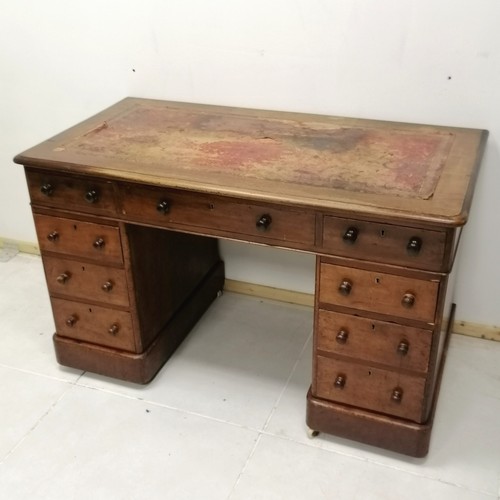 265 - Antique mahogany pedestal desk with china castors and red leather insert to top 107cm long x 67cm de... 