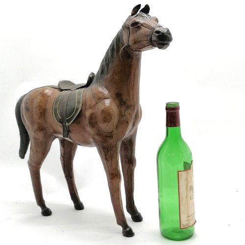 268 - Vintage leather horse with saddle and glass eyes. 49cm high x 48 long in overall good used condition... 