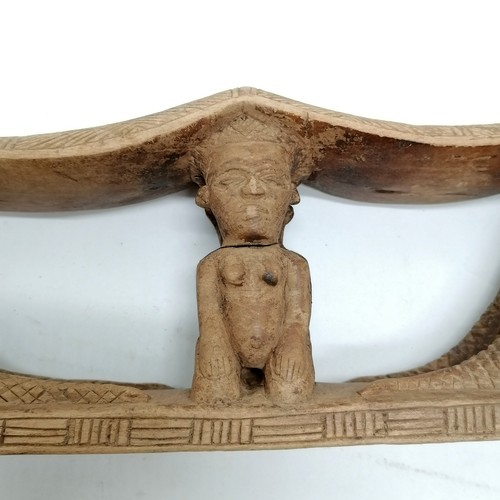 273 - Carved wooden tribal double headrest with 2 kneeling figures and 4 crocodiles. 38cm x 13cm. Some spl... 