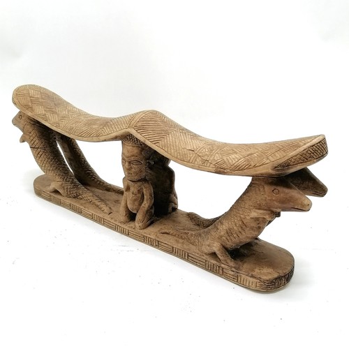 273 - Carved wooden tribal double headrest with 2 kneeling figures and 4 crocodiles. 38cm x 13cm. Some spl... 