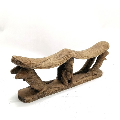 273 - Carved wooden tribal double headrest with 2 kneeling figures and 4 crocodiles. 38cm x 13cm. Some spl... 