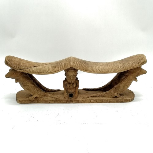 273 - Carved wooden tribal double headrest with 2 kneeling figures and 4 crocodiles. 38cm x 13cm. Some spl... 