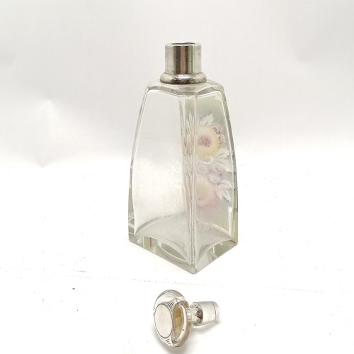 275 - Large art deco silver collared glass centre bottle with floral detail to one side. 22cm high has 3 s... 