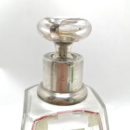 275 - Large art deco silver collared glass centre bottle with floral detail to one side. 22cm high has 3 s... 