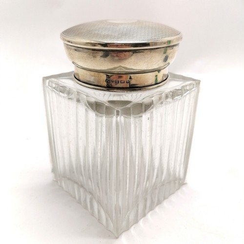 277 - Large square topped silver hallmarked jar with ribbed detail. Has chips to the body.