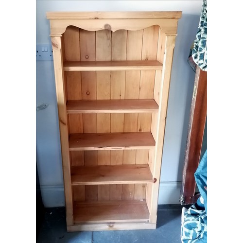 286 - Small pine shelf unit. 130cm x 60cm x 23cm. In overall good used condition.